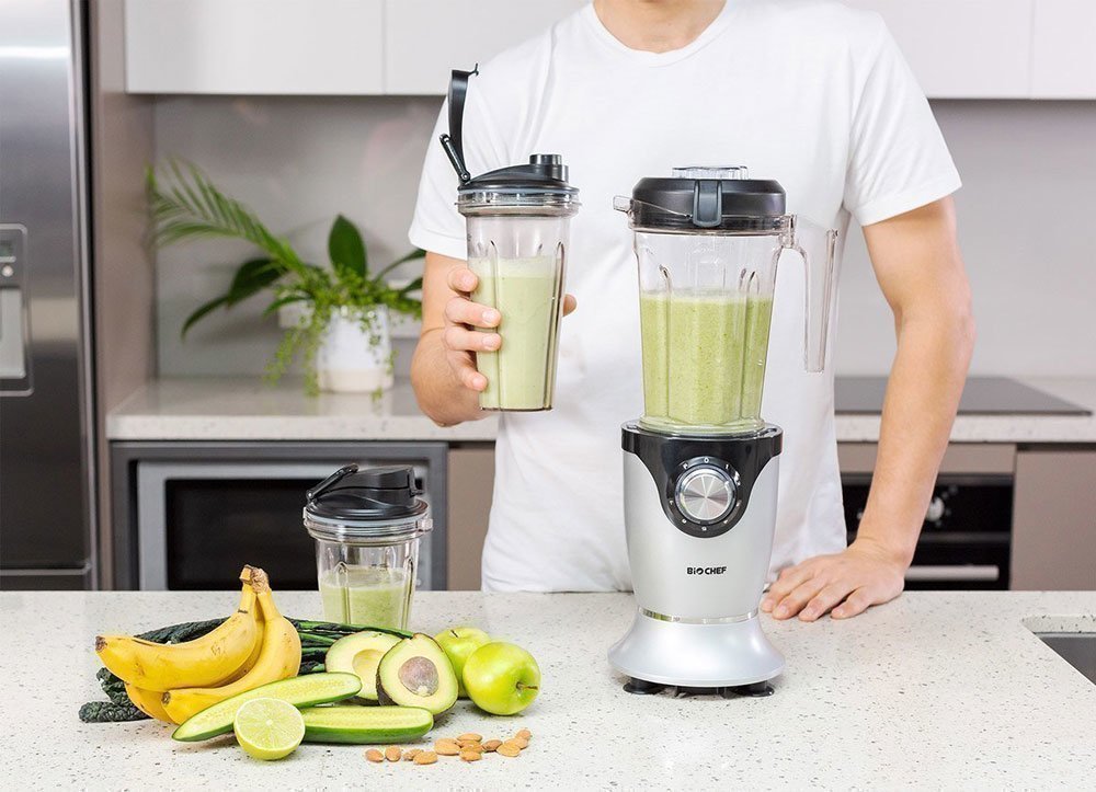 A delicious green smoothie made with a BioChef Blender and stored in travel cups.